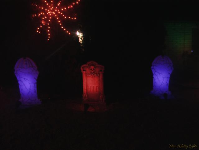 Close up of tombstones and spiderweb