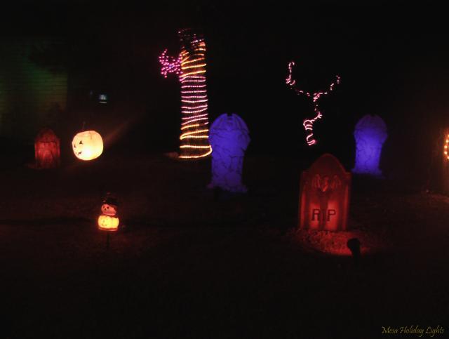 Close up of tombstones and rope lights