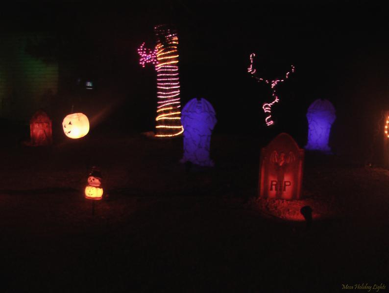 Close up of tombstones and rope lights