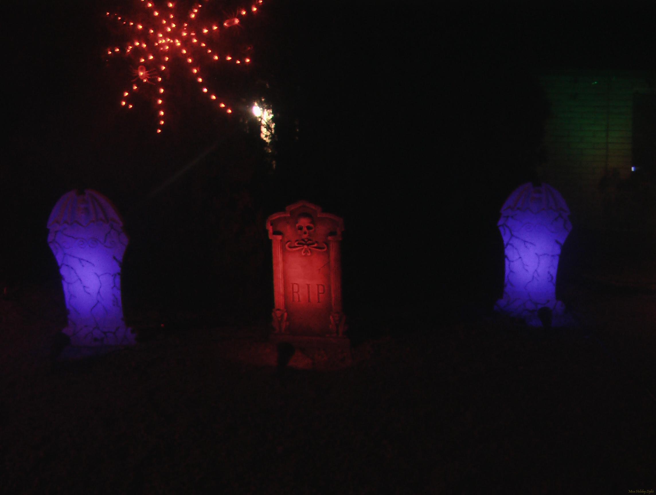 Close up of tombstones and spiderweb