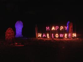 Happy Halloween Sign and tombstones