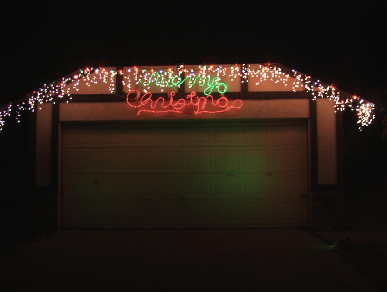Icicle Lights and Merry Christmas over garage