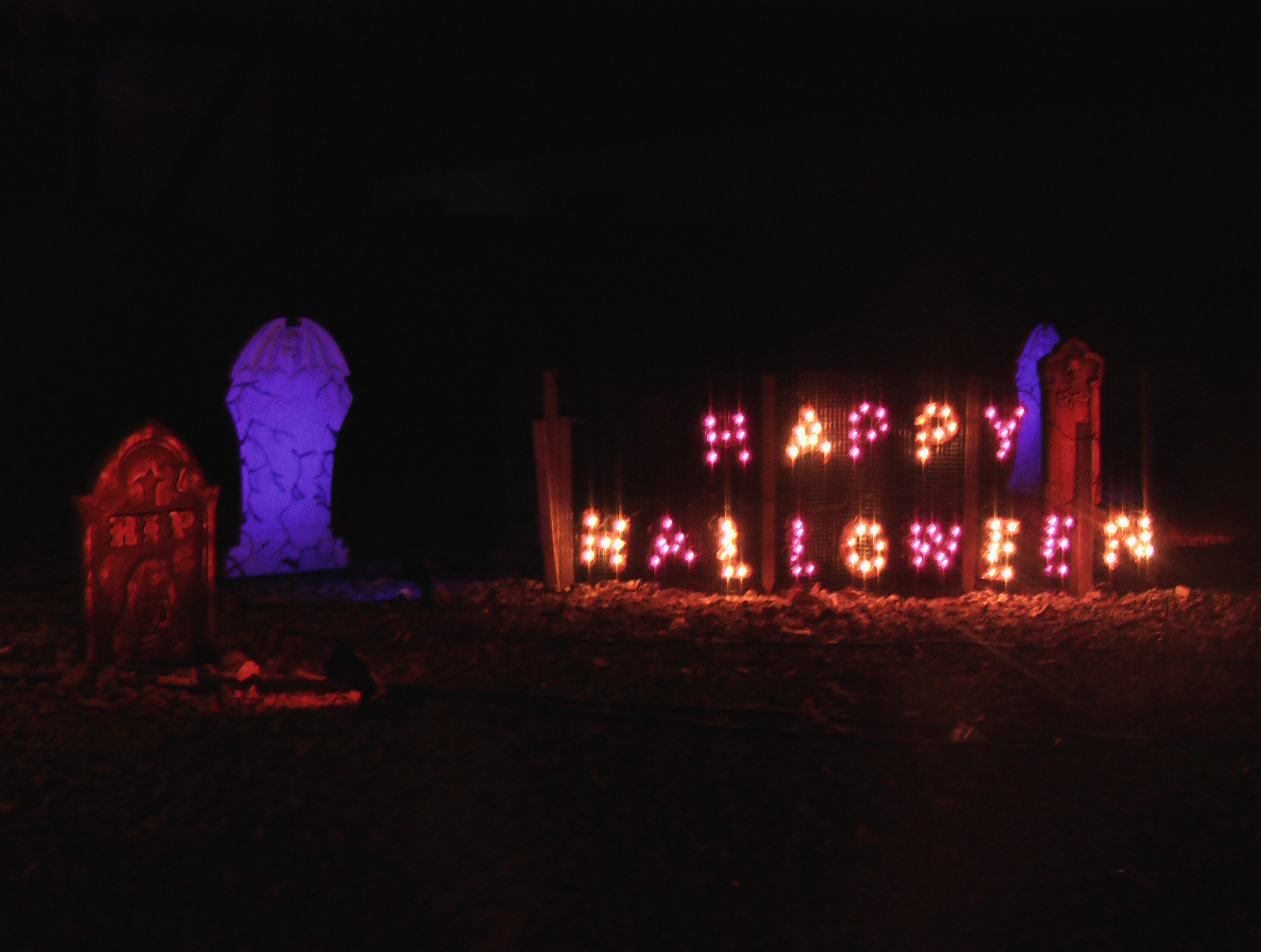 Happy Halloween Sign and tombstones